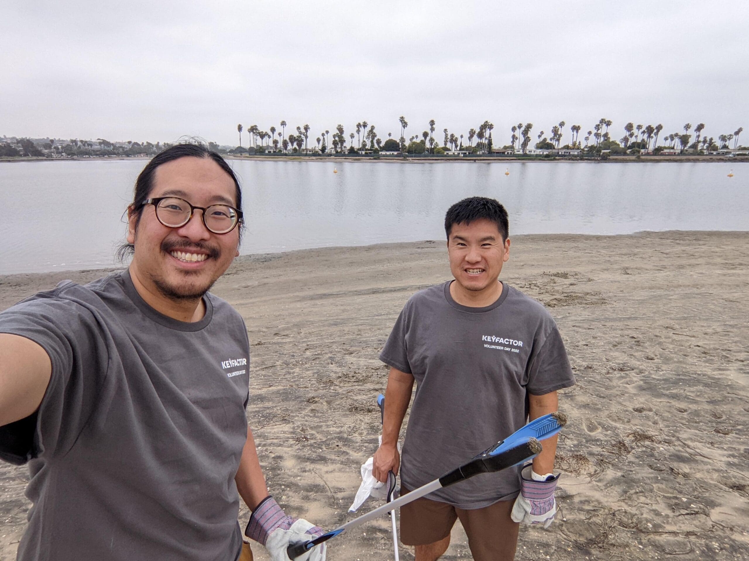 Keyfactor team members cleaning up a beach during Volunteer Days 2022